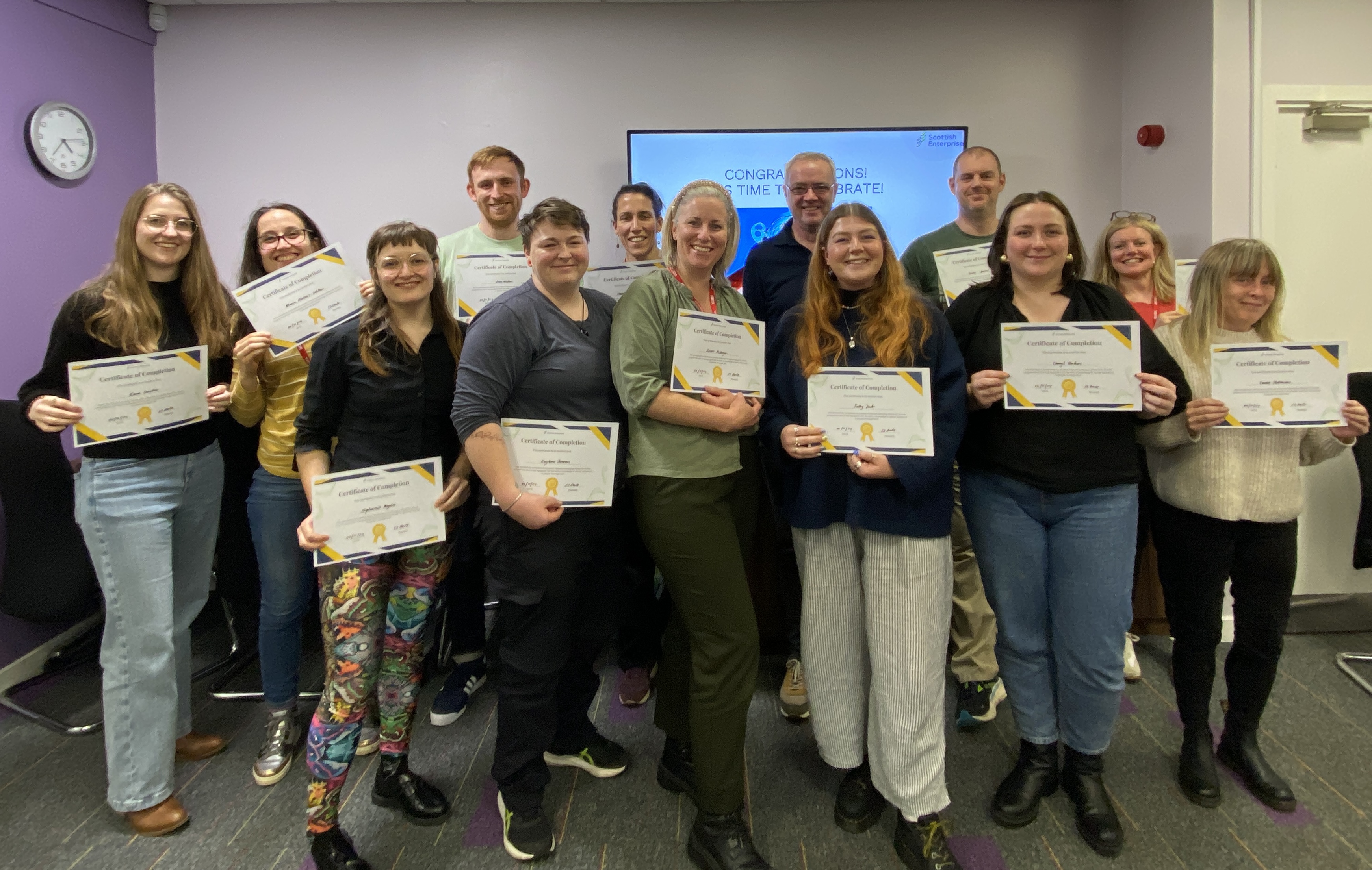 MPFG Edinburgh cohort celebrating programme completion with certificates